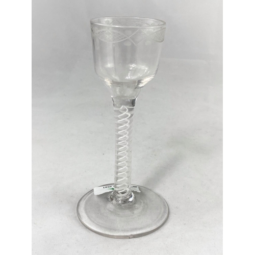 224 - An 18th century opaque twist wine with wheel turned ogee bowl
