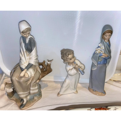 237 - 2 Lladro groups - seated girl with bird; boy with flute 25 & 26cm