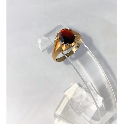 341 - A gent's 9 carat hallmarked gold gypsy style ring, set garnet, 3.2 gm