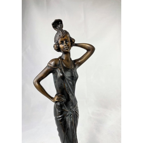 432 - A modern bronze figure depicting a young woman in 1920's flapper dress, height 33 cm; a similar figu... 