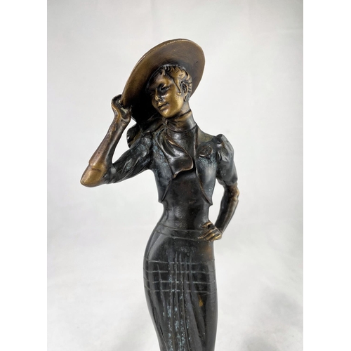 432 - A modern bronze figure depicting a young woman in 1920's flapper dress, height 33 cm; a similar figu... 