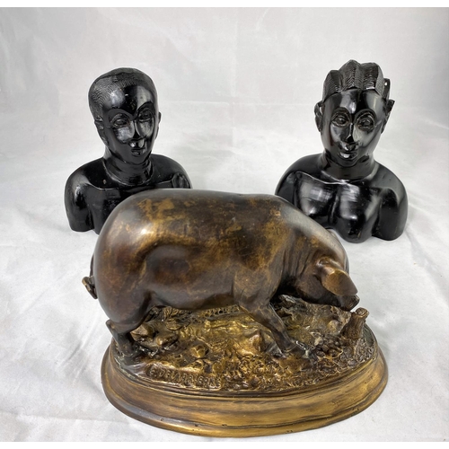 433 - After Delabrierre:  a modern bronze figure of a pig, on oval base, length 24 cm; a pair of African c... 