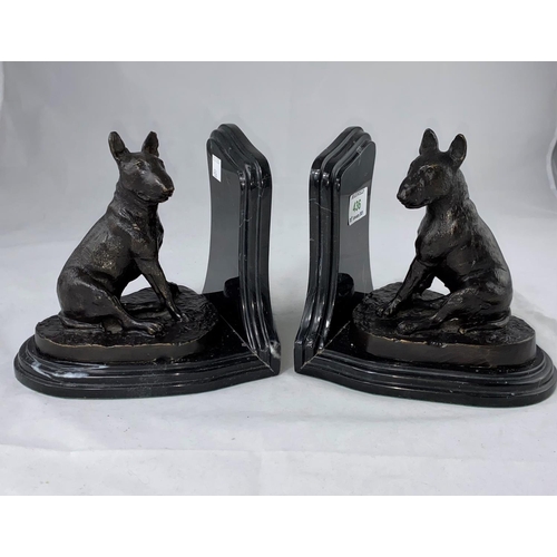 436 - After Barrie:  a pair of modern bronze and marble bookends in the form of seated bull terriers