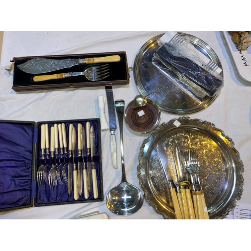340 - A selection of silver plate:  cased fish servers; decorate knives and forks; soup ladle; etc.