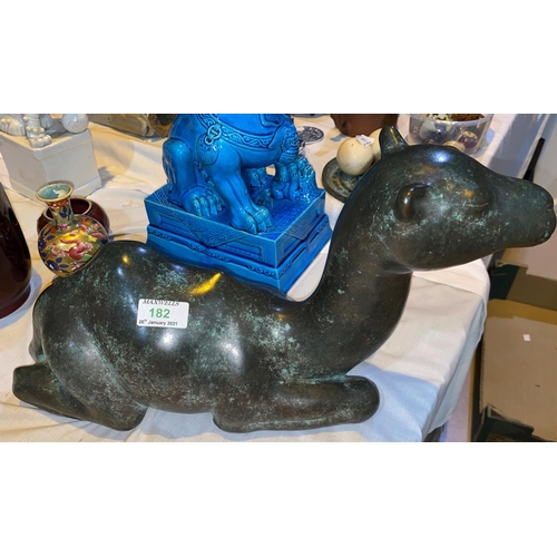 182a - A bronze figure of a reclining camel, length 46 cm (filled)