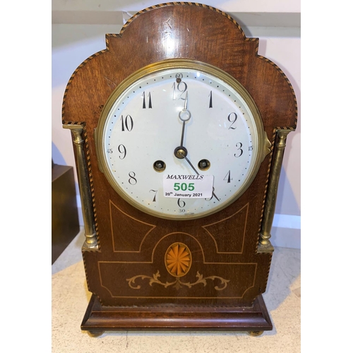 505 - An Edwardian mantel clock in Sheraton inlaid arch top case, with white enamel dial and French drum m... 