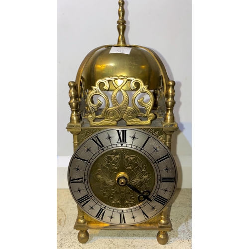 543 - An Edwardian dwarf bracket clock in inlaid mahogany arch top case, with silvered dial and French dru... 