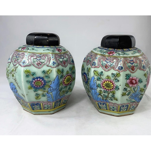 175 - A Chinese pair of octagonal jars, celadon glaze with raised polychrome decoration in the famille ros... 