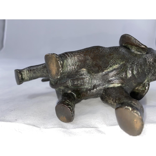 176B - A Japanese Meiji period bronze elephant with outstretched trunk, rectangular seal mark to underbelly... 