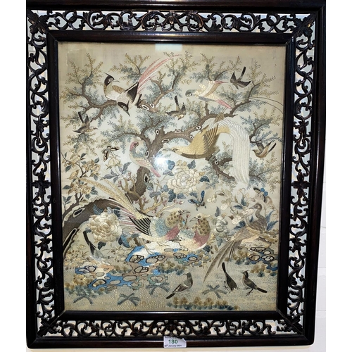 180 - A Chinese finely woven silk embroidery depicting pairs of exotic birds in carved and pierced hardwoo... 