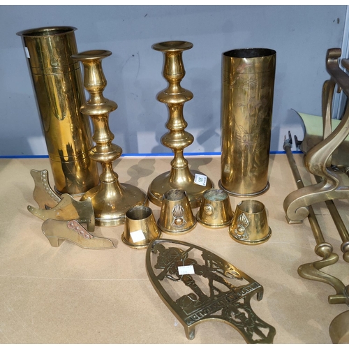 108 - A late Georgian good pair of brass candlesticks, 25 cm; a Boer War brass iron stand; items of trench... 