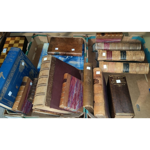125 - A selection of leather bound and other books, including a 19th century 3 volume bible and other reli... 