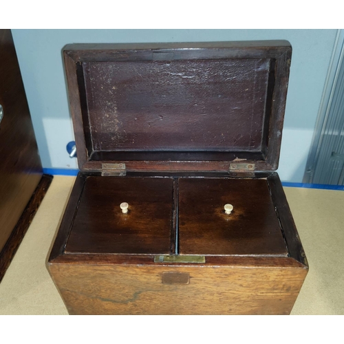 129 - A 19th century rosewood sarcophagus shaped tea caddy with 2 divisions, 22 cm