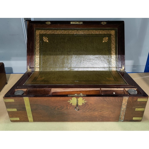 130 - A Victorian brass bound rosewood writing box, fitted interior with leather writing slope, 50 cm