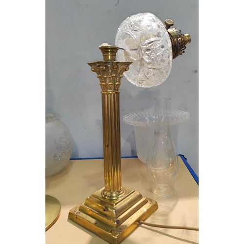 134 - A late 19th/early 20th century brass oil lamp, with Corinthian column, cut glass reservoir (a.f.), m... 