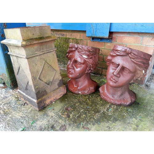 147 - A pair of terracotta head planters; a square section chimneypot