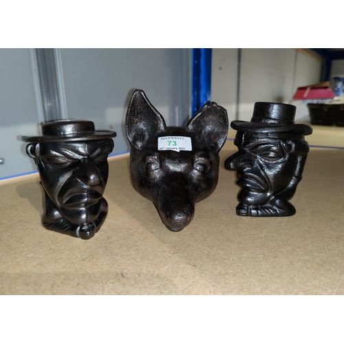73 - A fox head cast iron doorstop; 2 tobacco jars in the form of a man's head with hat
