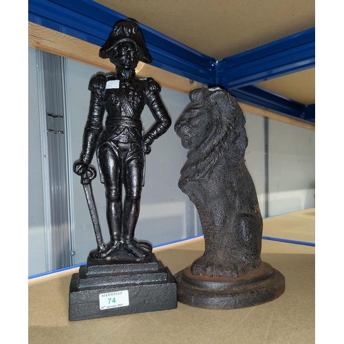 74 - Two cast iron doorstops:  seated lion and an admiral