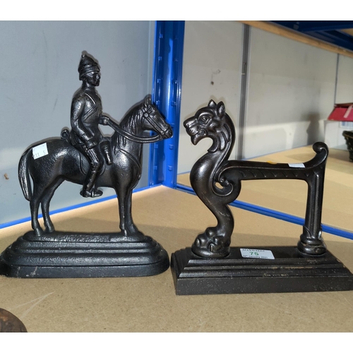 75 - Two cast iron doorstops:  horse and horse with rider