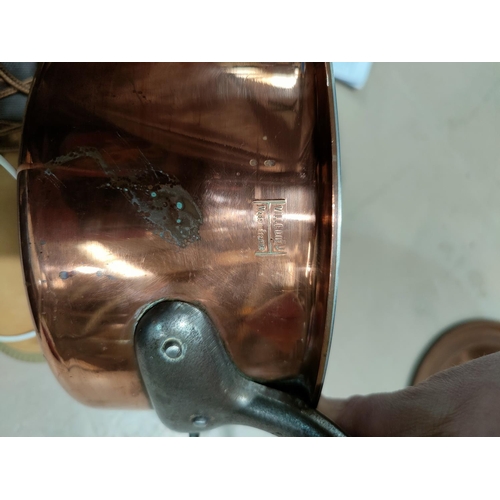 83 - A set of graduating copper pans