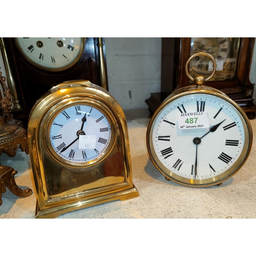 487 - A 19th century bedside clock in circular brass case, with white enamel dial and French drum movement... 