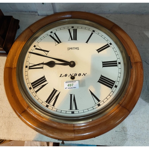 497 - A late 19th/early 20th century wall clock with circular dial, in stained wood case, timepiece moveme... 