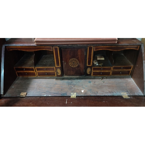 484 - A Georgian crossbanded mahogany bureau with fall front fitted interior, 3 long and 2 short drawers w... 