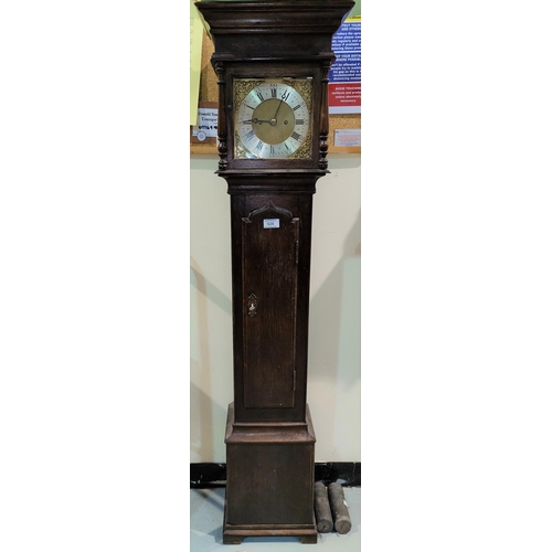 528 - An 18th century style dwarf longcase clock in oak case, with turned pillars to the hood and arched f... 