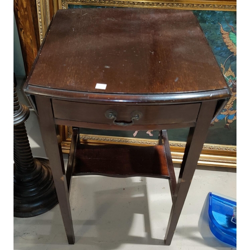567 - An Edwardian mahogany occasional table with oval drop leaf top and frieze drawer, on square tapering... 