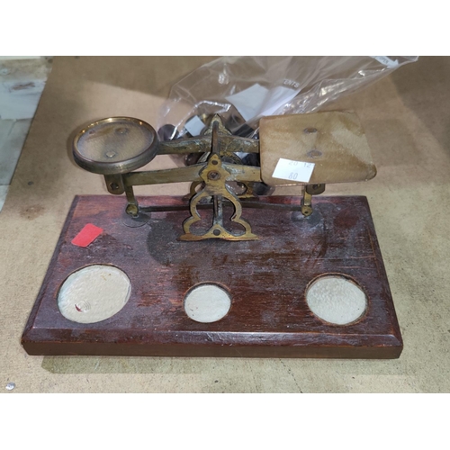 80 - A set of 19th century brass postage scales and weights; a textile calculator; a 'dog's head' novelty... 