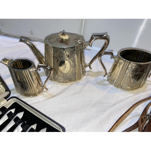 316 - A Victorian 3 piece silver plated tea set with chased decoration; a cased set of mother-of-pearl eff... 