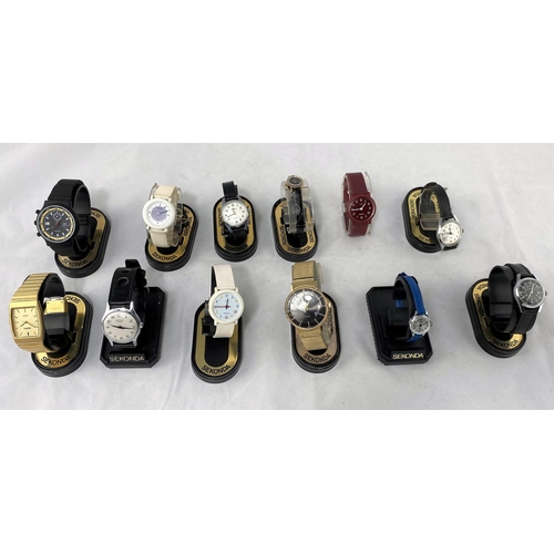 33 - A large selection of unused travelling alarm clocks and Sekonda watches