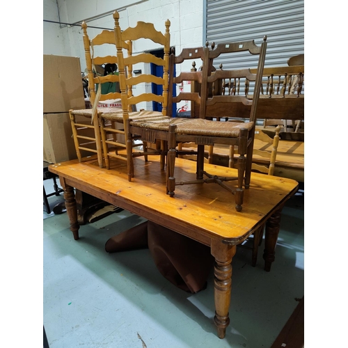 463 - Two 19th century French chairs with ladderbacks; A natural pine kitchen table carried on turned legs... 