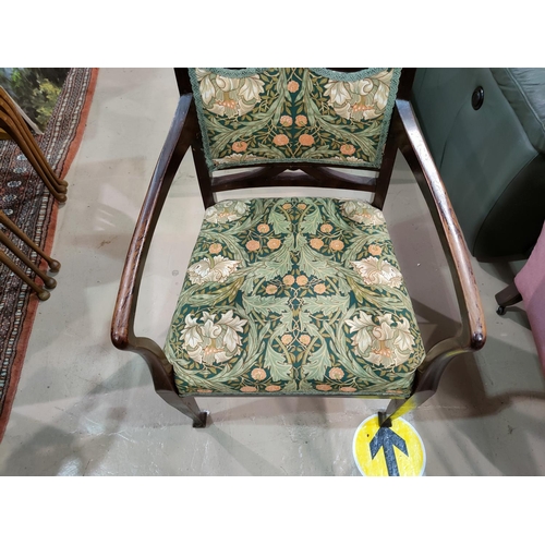 558 - A mahogany Art Nouveau armchair upholstered in a William Morris print