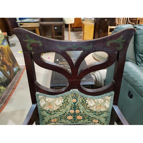 558 - A mahogany Art Nouveau armchair upholstered in a William Morris print