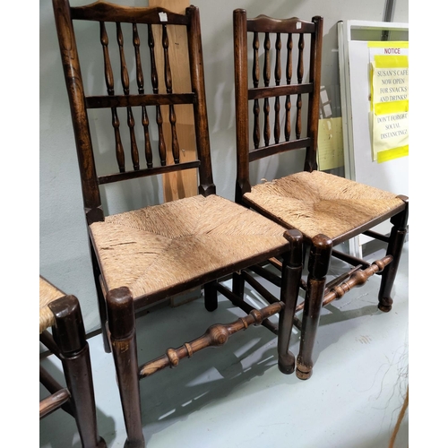 686 - A 19th century set of 6 country made elm dining chairs with spindle backs and rush seats (some seat ... 