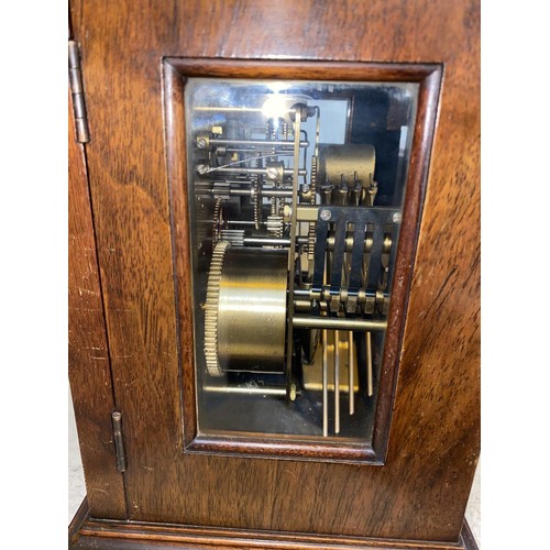 493 - A reproduction 18th century style bracket clock in walnut caddy top case, brass dial and chiming mov... 