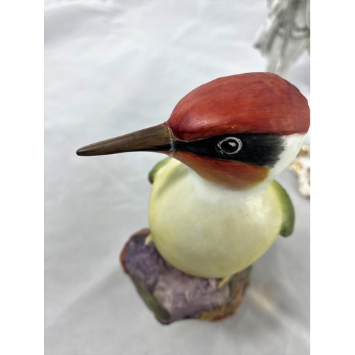 236 - A Royal Crown Derby pink bird;a Royal Worcester woodpecker; an 18th century style Austrian figure; e... 