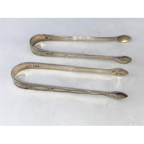 264 - A pair of Georgian bright cut silver sugar tongs, Peter and Anne Bateman, London, and another simila... 