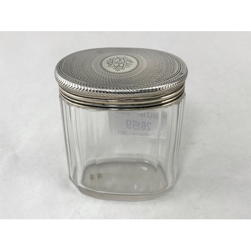 269 - A cut glass silver jar with embossed silver top embossed with cherubs, 7cm and 3 others
