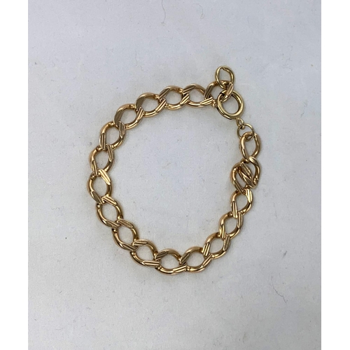 313 - A yellow metal bracelet formed from flatted curb links, stamped '9ct', 19.6 gm