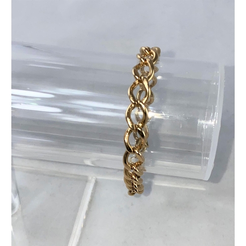 313 - A yellow metal bracelet formed from flatted curb links, stamped '9ct', 19.6 gm