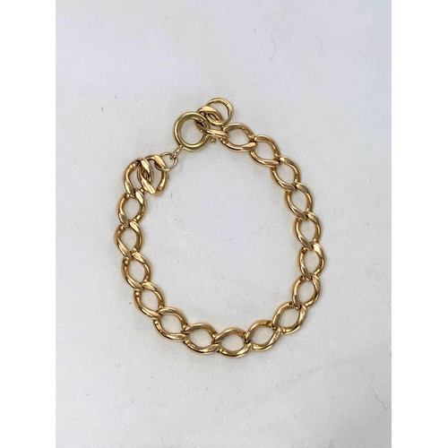 313 - A yellow metal bracelet formed from flatted curb links, stamped '9ct', 19.6 gm