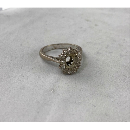 317 - A white metal and diamond ring stamped '18ct' size 'J' (central stone missing); a yellow metal etern... 