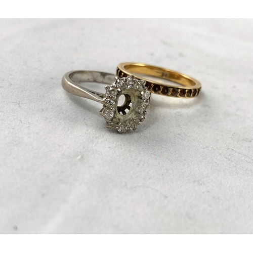 317 - A white metal and diamond ring stamped '18ct' size 'J' (central stone missing); a yellow metal etern... 