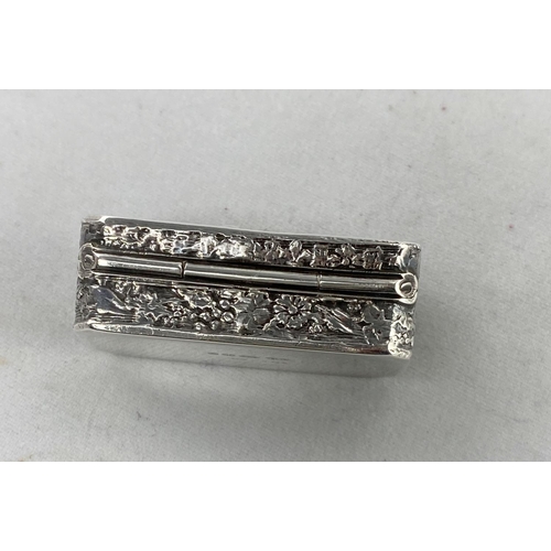 357 - A rectangular pill box with embossed decoration, import marks 1878