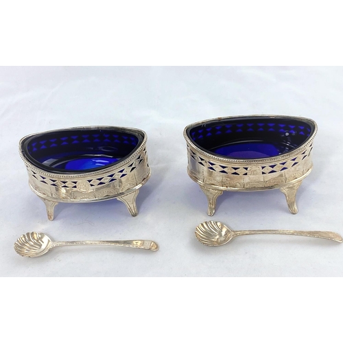 367 - A Georgian pair of boat shaped salts in the Adam style with pierced bright cut decoration, on splay ... 