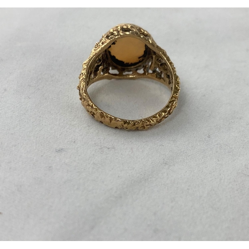 374 - A 1960's/70's modernist 9 carat hallmarked gold dress ring with naturalistic pierced shoulders, set ... 