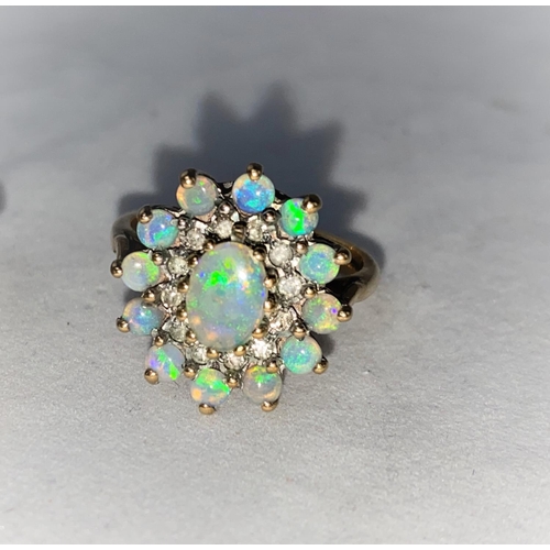 377 - A 9 carat hallmarked gold dress ring set large oval opal coloured stone size 'O'; a 9 carat hallmark... 