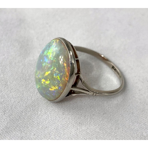 384 - A white metal dress ring set large opal coloured stone, stamped 'PLATINUM', length of stone 17 mm ap... 